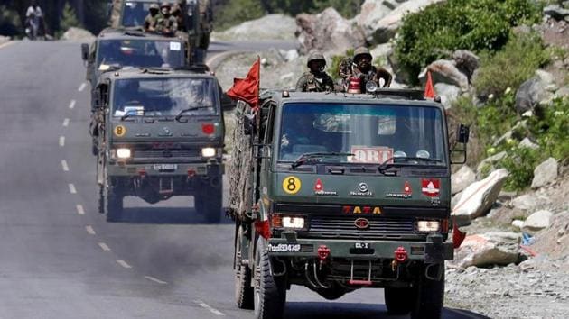 An Indian Army convoy moves along a highway leading to Ladakh, at Gagangeer in Kashmir's Ganderbal district, on June 18. (Reuters File Photo) An Indian Army convoy moves along a highway leading to Ladakh, at Gagangeer in Kashmir's Ganderbal district, on June 18. (Reuters File Photo)
