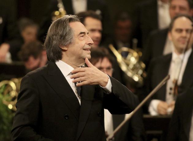 FILE - In this Jan. 1, 2018 file photo, Italian Maestro Riccardo Muti conducts the Vienna Philharmonic Orchestra during the traditional New Year's concert at the golden hall of Vienna's Musikverein, Austria. Nine musicians from the Syrian diaspora in Europe are playing in the 24th friendship concert conducted by Riccardo Muti, this year at the Paestum archaeological site in southern Italy, but the coronavirus pandemic blocked others from arriving directly from Syria. (AP Photo/Ronald Zak, File)(AP)