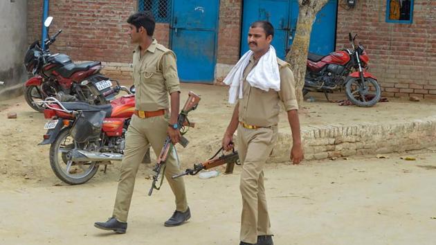 Police personnel during a search operation near the house of gangster Vikas Dubey in Kanpur on Sunday.(PTI Photo)