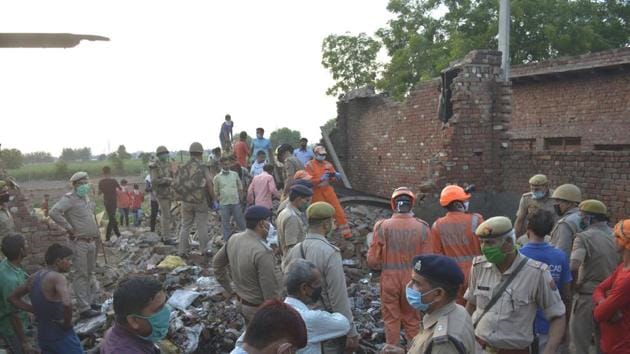 NDRF personnel investigate the site of a fire at Bakharwa village in Modinagar town, Ghaziabad on July 5, 2020. (Sakib Ali/HT Photo) NDRF personnel investigate the site of a fire at Bakharwa village in Modinagar town, Ghaziabad on July 5, 2020. (Sakib Ali/HT Photo)
