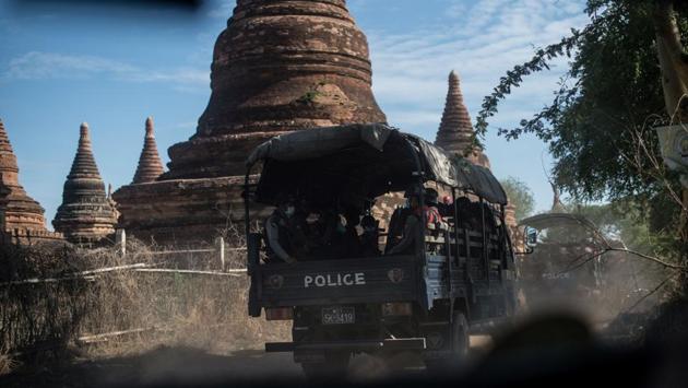 Members of a police squad on patrol in a temple complex in Bagan. A dearth of visitors means temples and hotels lie empty, crushing the livelihoods of locals in an economy leaning heavy on tourism, opening doors to opportunistic burglars. (Ye Aung Thu / AFP) Members of a police squad on patrol in a temple complex in Bagan. A dearth of visitors means temples and hotels lie empty, crushing the livelihoods of locals in an economy leaning heavy on tourism, opening doors to opportunistic burglars. (Ye Aung Thu / AFP)