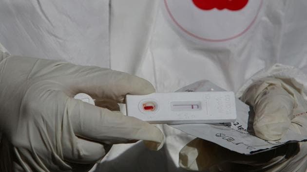 A health worker in personal protective equipment (PPE) shows a blood sample from a resident, while conducting tests for the coronavirus disease (Covid-19), in the neighbourhood of El Tejar, in La Paz, Bolivia on July 5, 2020. (Reuters File Photo)