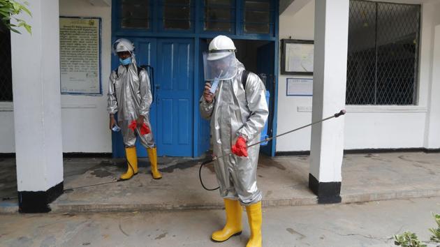 A member of Sri Lanka's St John's ambulance service drinks a beverage during a break in between a spraying of disinfectants at a public school to prevent the spread of coronavirus in Colombo, Sri Lanka. (AP File Photo) A member of Sri Lanka's St John's ambulance service drinks a beverage during a break in between a spraying of disinfectants at a public school to prevent the spread of coronavirus in Colombo, Sri Lanka. (AP File Photo)