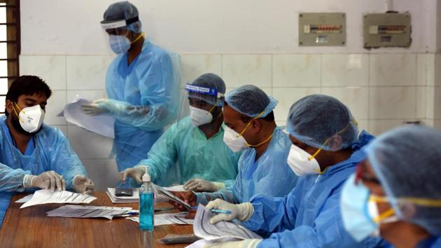 Medics at work in a Covid-19 Testing Centre at the Rajiv Gandhi Super Specialty Hospital in New Delhi on July 6. Delhi on July 6 recorded 1,379 new Covid-19 cases, its lowest daily increase since June 9 but enough to take the capital’s total case count to a grim 100,823 with 3,115 lives lost as of last count. (Sonu Mehta / HT Photo) Medics at work in a Covid-19 Testing Centre at the Rajiv Gandhi Super Specialty Hospital in New Delhi on July 6. Delhi on July 6 recorded 1,379 new Covid-19 cases, its lowest daily increase since June 9 but enough to take the capital’s total case count to a grim 100,823 with 3,115 lives lost as of last count. (Sonu Mehta / HT Photo)