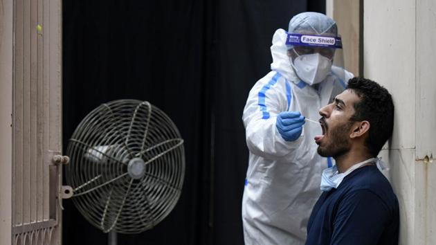 A health worker collects a nasal swab sample in New Delhi on July 6. The number of daily Covid-19 tests performed in the city dipped to 13,879 in yesterday bulletin in line with recent dips on Sundays. The testing figure has remained between 25,000-27,000 for the last two weeks—reaching a peak of 28,329 active cases on June 27. (Biplov Bhuyan / HT Photo) A health worker collects a nasal swab sample in New Delhi on July 6. The number of daily Covid-19 tests performed in the city dipped to 13,879 in yesterday bulletin in line with recent dips on Sundays. The testing figure has remained between 25,000-27,000 for the last two weeks—reaching a peak of 28,329 active cases on June 27. (Biplov Bhuyan / HT Photo)