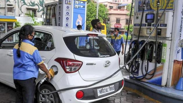 An employee fills fuel in a vehicle at a filling station, during fifth phase of Covid-19 lockdown in Kolkata.(PTI File Photo)