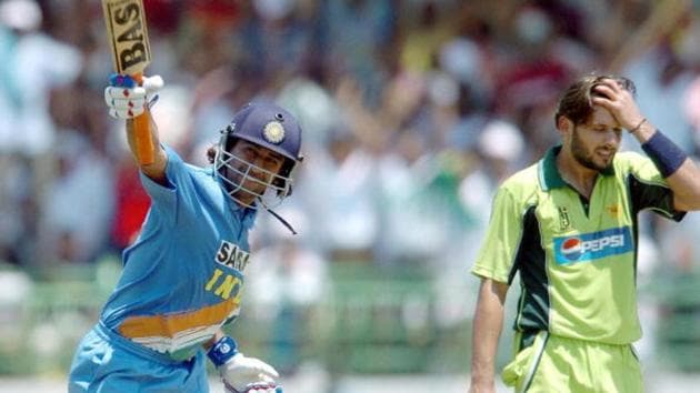 Indian cricketer Mahender Dhoni (L) celebrates after scoring a century.(AFP/Getty Images) Indian cricketer Mahender Dhoni (L) celebrates after scoring a century.(AFP/Getty Images)