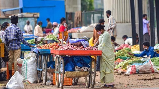 People buy vegetables near the toll gate on the National Highway 4 in Bengaluru. On June 6, Bengaluru accounted for 162 of the 3,184 active cases in Karnataka. It had a mere 5% of the cases in the state. On July 5, the city’s tally of active cases stood at 8,167, accounting for over 60% of cases under treatment in the state, reported HT. (Shailendra Bhojak / PTI) People buy vegetables near the toll gate on the National Highway 4 in Bengaluru. On June 6, Bengaluru accounted for 162 of the 3,184 active cases in Karnataka. It had a mere 5% of the cases in the state. On July 5, the city’s tally of active cases stood at 8,167, accounting for over 60% of cases under treatment in the state, reported HT. (Shailendra Bhojak / PTI)