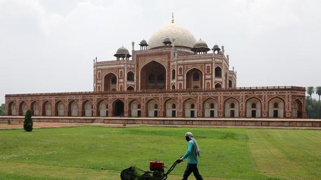 A worker cuts the grass in front of Humayun's Tomb, after authorities reopened it for visitors following a three-month lockdown that was imposed to slow the spread of the coronavirus disease (COVID-19), in New Delhi. (REUTERS) A worker cuts the grass in front of Humayun's Tomb, after authorities reopened it for visitors following a three-month lockdown that was imposed to slow the spread of the coronavirus disease (COVID-19), in New Delhi. (REUTERS)