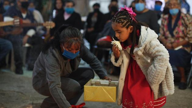 A child kisses a flower during the cross raising ceremony for her grandmother in their family home in Valle de Chalco on the outskirts of Mexico City. Mexico overtook France with the fifth-deadliest outbreak on July 4. (Rebecca Blackwell / AP) A child kisses a flower during the cross raising ceremony for her grandmother in their family home in Valle de Chalco on the outskirts of Mexico City. Mexico overtook France with the fifth-deadliest outbreak on July 4. (Rebecca Blackwell / AP)