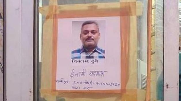 Posters seeking information about criminal Vikas Dubey, on the run since last Friday. (ANI photo)