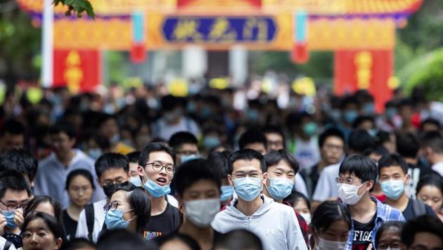 Students leave a testing site for China's national college entrance examinations, also known as the gaokao, in Nanjing in eastern China's Jiangsu Province, Tuesday, July 7, 2020.(AP)