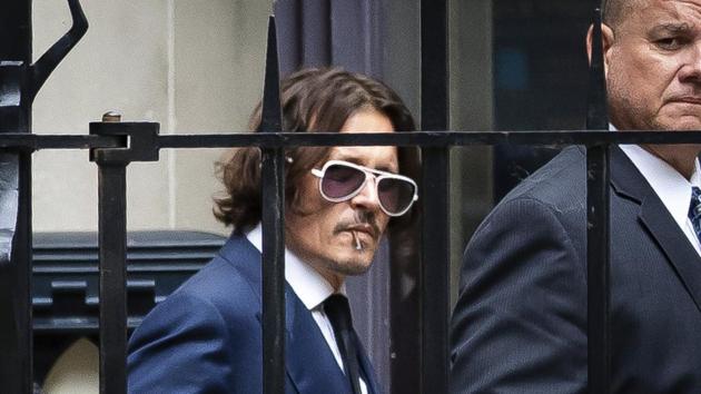 Actor Johnny Depp leaves the High Court in London.(AP)