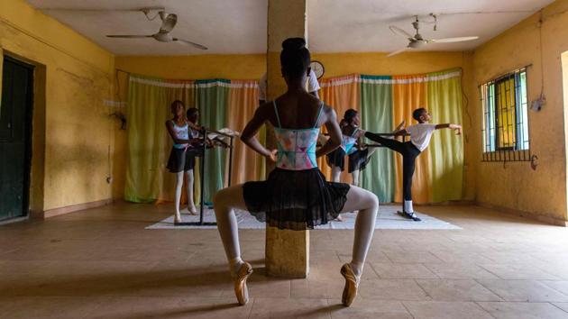 Olamide Olawole (front) stands in the Releve sur la pointe position during rehearsals on July 3. Ballet has provided an inspiration and window into unknown cultures for the 15-year-old Olawole. “My dream is to make children around the world to be able to share the same dance experience,” Olawole, who is thinking of becoming a dance teacher herself, told AFP. (Benson Ibeabuchi / AFP)