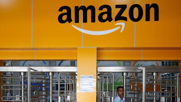An employee of Amazon walks through a turnstile gate inside an Amazon Fulfillment Centre (BLR7) on the outskirts of Bengaluru.(REUTERS)
