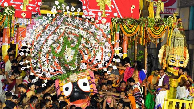 A view of temple priests and sevayats (servitors) performing ritual of Niladri Bije(homecoming of the tri-Deities) Goti Pahandi of Lord Balabhadra as part of concluding ritual of Rath yatra festival being set to ushered into the sanctum sanctorum of Srimandir(Jagannath temple) amid the Unlock 2.0 in the wake of coronavirus, in Puri on Saturday. (ANI) A view of temple priests and sevayats (servitors) performing ritual of Niladri Bije(homecoming of the tri-Deities) Goti Pahandi of Lord Balabhadra as part of concluding ritual of Rath yatra festival being set to ushered into the sanctum sanctorum of Srimandir(Jagannath temple) amid the Unlock 2.0 in the wake of coronavirus, in Puri on Saturday. (ANI)