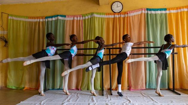 Students stretch during rehearsals at the Leap of Dance Academy on July 3. Now after several years of training and effort the dancers have gained more acceptance. “We want to make sure to show them that this is not a bad dance -- ballet is a very disciplined, forward dance that is very important in the growth of a child,” Ajala said. (Benson Ibeabuchi / AFP)