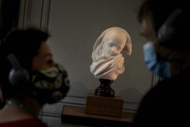 Visitor watch l'Orpheline Alsacienne by French sculptor Auguste Rodin in Paris Tuesday, July 7, 2020. (AP) Visitor watch l'Orpheline Alsacienne by French sculptor Auguste Rodin in Paris Tuesday, July 7, 2020. (AP)