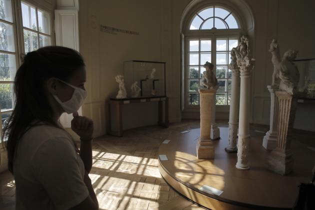 A traveler visits the Rodin museum in Paris Tuesday, July 7, 2020. (AP) A traveler visits the Rodin museum in Paris Tuesday, July 7, 2020. (AP)