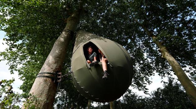 Guests sit inside this unusual accommodation for tourists in the Belgian countryside, near Borgloon, Belgium. (REUTERS/Francois Lenoir)