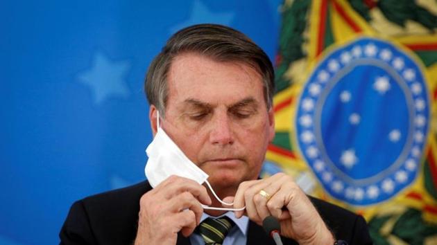 In a closed-door meeting in May, Environment Minister Ricardo Salles urged President Bolsonaro to take advantage of global leaders’ Covid-19 blinders to simplify regulations, according to a video of the gathering released by the Supreme Court.(Reuters file photo) In a closed-door meeting in May, Environment Minister Ricardo Salles urged President Bolsonaro to take advantage of global leaders’ Covid-19 blinders to simplify regulations, according to a video of the gathering released by the Supreme Court.(Reuters file photo)
