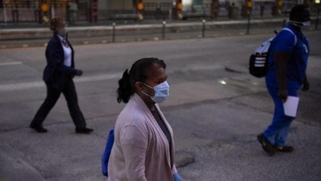 Health workers walk through the Texas Medical Centre during a shift change as cases of the coronavirus spike in Houston, Texas on July 8. The Texas state fair, which had been scheduled to open on September 25, has been cancelled for the first time since World War Two, organizers announced on July 7. (Callaghan O'Hare / REUTERS)