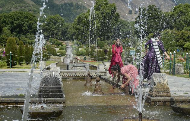 Srinagar: Girls play at Mughal garden after the authorities decided to reopen it for tourists, during Unlock 2.0, in Srinagar, Wednesday, July 8, 2020. (PTI)