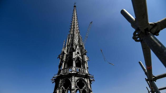 The spire of the Notre Dame cathedral is seen during restoration work on April 11, 2019. In what is the final consensus, there will be no swimming pool or organic garden on the roof of the medieval Paris monument, or contemporary glass spire, or other modern twists. (BERTRAND GUAY /AFP File) The spire of the Notre Dame cathedral is seen during restoration work on April 11, 2019. In what is the final consensus, there will be no swimming pool or organic garden on the roof of the medieval Paris monument, or contemporary glass spire, or other modern twists. (BERTRAND GUAY /AFP File)