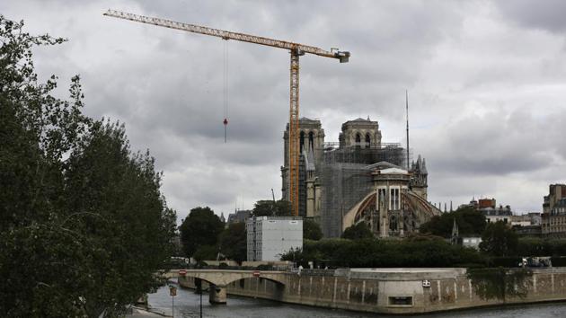 A view showing the restoration work at Notre Dame Cathedral in Paris on July 10. The Notre Dame Cathedral spire will be rebuilt just the way it stood before last year’s devastating fire. To stay historically accurate, it will again be built with potentially toxic lead. (Thibault Camus / AP) A view showing the restoration work at Notre Dame Cathedral in Paris on July 10. The Notre Dame Cathedral spire will be rebuilt just the way it stood before last year’s devastating fire. To stay historically accurate, it will again be built with potentially toxic lead. (Thibault Camus / AP)