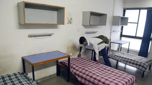 A worker makes beds for Covid-19 patients at COEP students’ hostel, which is temporarily turned into a quarantine facility in Pune on July 9. On July 9, the number of recovered cases had overshot the number of active cases by 206,588. Total recovered cases are almost twice the number of active cases now. (Shankar Narayan / HT Photo) A worker makes beds for Covid-19 patients at COEP students’ hostel, which is temporarily turned into a quarantine facility in Pune on July 9. On July 9, the number of recovered cases had overshot the number of active cases by 206,588. Total recovered cases are almost twice the number of active cases now. (Shankar Narayan / HT Photo)