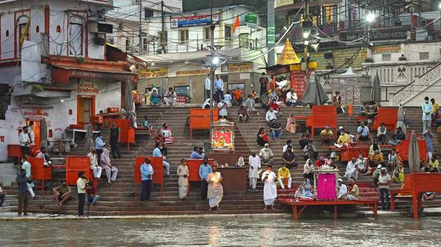 Hindu devotees attend evening prayers at Har Ki Pauri ghat on the banks of the river Ganges, after the government eased a nationwide lockdown imposed as a preventive measure against the Covid-19 coronavirus at Haridwar in Uttarakhand state. (AFP) Hindu devotees attend evening prayers at Har Ki Pauri ghat on the banks of the river Ganges, after the government eased a nationwide lockdown imposed as a preventive measure against the Covid-19 coronavirus at Haridwar in Uttarakhand state. (AFP)