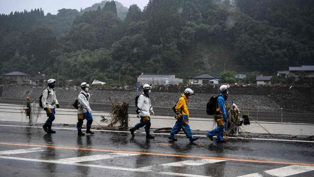 Police arrives to help in rescue and clean up operations in Kuma village on July 9. Japan Meteorological Agency (JMA) issued its second-highest evacuation order to more than 450,000 people. However, such orders are not compulsory and most residents are choosing not to go to shelters, possibly due to coronavirus fears. (CHARLY TRIBALLEAU / AFP)