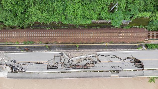 Japanese emergency services and troops continue to face challenges in their rescue operations and reach thousands of homes cut off by catastrophic flooding. The death toll has risen to 66 as of July 10 morning, with 16 others still missing, the Fire and Disaster Management Agency told AP. (Quentin TYBERGHIEN / AFP)