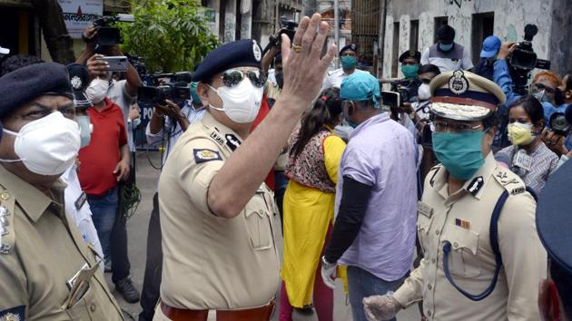 Kolkata commissioner of police Anuj Sharma at Telangana Bagan area in Kolkata enforcing total lockdown on Friday.(ANI Photo)