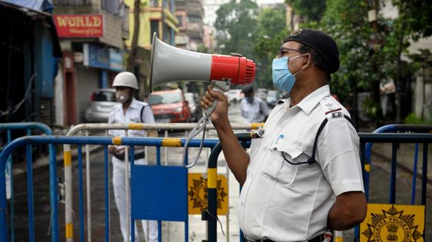 A Kolkata Police personnel speaks on the loudspeaker, alerting people to not step out of their homes in Kankurgachi – one of the new Covid-19 containment zones in Kolkata, on July 9. In the highest jump so far, India recorded 26,506 new cases of the coronavirus disease (Covid-19) between July 9 and July 10 morning, pushing its infection tally to 793,802, according to the Union health ministry. (Samir Jana / HT Photo) A Kolkata Police personnel speaks on the loudspeaker, alerting people to not step out of their homes in Kankurgachi – one of the new Covid-19 containment zones in Kolkata, on July 9. In the highest jump so far, India recorded 26,506 new cases of the coronavirus disease (Covid-19) between July 9 and July 10 morning, pushing its infection tally to 793,802, according to the Union health ministry. (Samir Jana / HT Photo)