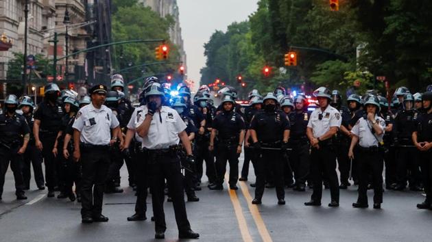 Police officers stand guard across Central Park West during a protest against the death in Minneapolis police custody of George Floyd, in the Manhattan borough of New York City, New York, US.(REUTERS)