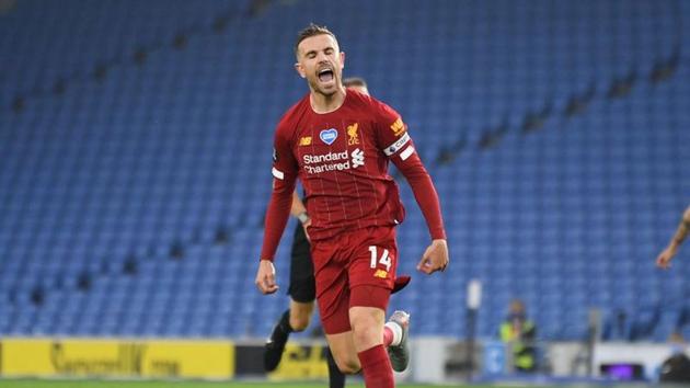 Liverpool's Jordan Henderson celebrates scoring their second goal, as play resumes behind closed doors following the outbreak of the coronavirus disease (COVID-19) Daniel Leal Olivas/Pool via REUTERS(REUTERS)