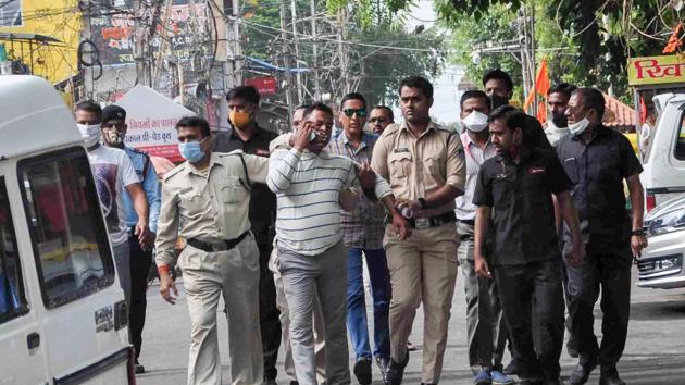 Gangster Vikas Dubey, the main accused in killing of eight policemen in the Kanpur encounter recently, being apprehended by police personnel after a nearly week-long manhunt, in Ujjain. (PTI) Gangster Vikas Dubey, the main accused in killing of eight policemen in the Kanpur encounter recently, being apprehended by police personnel after a nearly week-long manhunt, in Ujjain. (PTI)