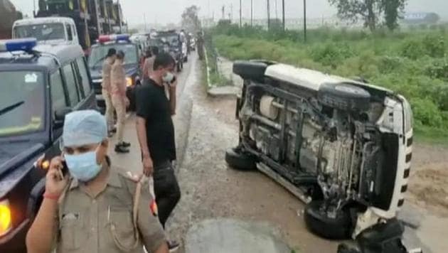 An overturned vehicle at the encounter site where gangster Vikas Dubey was killed while he tried to escape from the spot following an accident, near Kanpur on Friday morning.(PTI Photo)