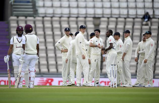 England's James Anderson, center left, and teammates get together as third umpire overturned the successful appeal by him during the second day of the first cricket Test match between England and West Indies, at the Ageas Bowl in Southampton, England, Thursday, July 9, 2020. (Mike Hewitt/Pool via AP) (AP) England's James Anderson, center left, and teammates get together as third umpire overturned the successful appeal by him during the second day of the first cricket Test match between England and West Indies, at the Ageas Bowl in Southampton, England, Thursday, July 9, 2020. (Mike Hewitt/Pool via AP) (AP)