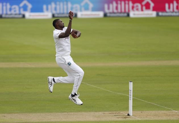 West Indies' captain Jason Holder bowls on the first day of the 1st cricket Test match between England and West Indies, at the Ageas Bowl in Southampton, England, Wednesday July 8, 2020. (Adrian Dennis/Pool via AP) (AP) West Indies' captain Jason Holder bowls on the first day of the 1st cricket Test match between England and West Indies, at the Ageas Bowl in Southampton, England, Wednesday July 8, 2020. (Adrian Dennis/Pool via AP) (AP)