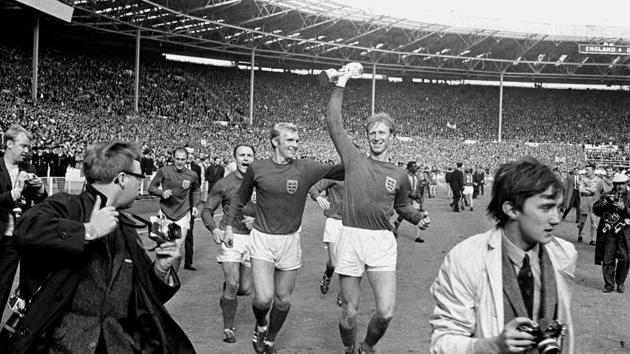 FILE - In this July 30, 1966 file photo England's Jack Charlton, right, holds the Jules Rimet trophy aloft as he parades it around Wembley with teammate Bobby Moore following their 4-2 win over West Germany. England World Cup winner Jack Charlton has died aged 85 it was announced on Saturday July 11, 2020. (PA via AP) (AP) FILE - In this July 30, 1966 file photo England's Jack Charlton, right, holds the Jules Rimet trophy aloft as he parades it around Wembley with teammate Bobby Moore following their 4-2 win over West Germany. England World Cup winner Jack Charlton has died aged 85 it was announced on Saturday July 11, 2020. (PA via AP) (AP)