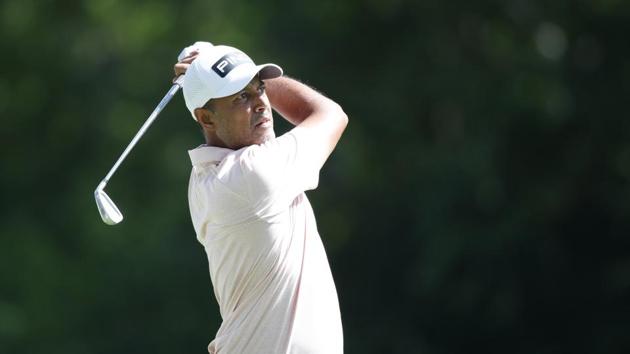Jul 4, 2020; Detroit, Michigan, USA; Arjun Atwal plays from the 9th tee during the third round of the Rocket Mortgage Classic golf tournament at Detroit Golf Club. Mandatory Credit: Brian Spurlock-USA TODAY Sports(USA TODAY Sports)