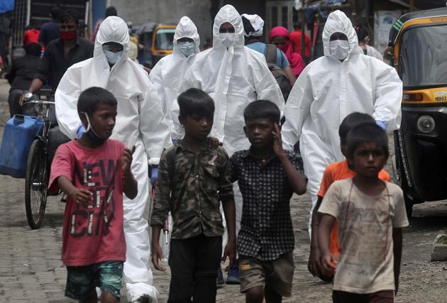 Health workers wearing protective clothing arrive to screen people for COVID-19 symptoms at a slum in Mumbai, India, Friday, July 10, 2020. India has overtaken Russia to become the third worst-affected nation by the coronavirus pandemic.(AP) Health workers wearing protective clothing arrive to screen people for COVID-19 symptoms at a slum in Mumbai, India, Friday, July 10, 2020. India has overtaken Russia to become the third worst-affected nation by the coronavirus pandemic.(AP)