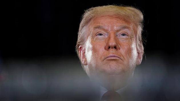 US President Donald Trump sits behind stacks of confiscated drugs while attending a briefing in Doral, Florida. (REUTERS) US President Donald Trump sits behind stacks of confiscated drugs while attending a briefing in Doral, Florida. (REUTERS)
