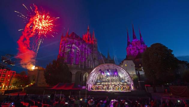 Singers and orchestra musicians perform during the rehearsal of the Cathedral Steps open air festival (Domstufen-Festspiele) in front of Mariendom (Cathedral of Mary) and St. Severi's Church in Erfurt, Germany, Wednesday, July 8, 2020. (AP)