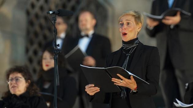 Choir members sing during the rehearsal of the Cathedral Steps open air festival (Domstufen-Festspiele) in front of Mariendom (Cathedral of Mary) and St. Severi's Church in Erfurt, Germany, Wednesday, July 8, 2020. (AP) Choir members sing during the rehearsal of the Cathedral Steps open air festival (Domstufen-Festspiele) in front of Mariendom (Cathedral of Mary) and St. Severi's Church in Erfurt, Germany, Wednesday, July 8, 2020. (AP)