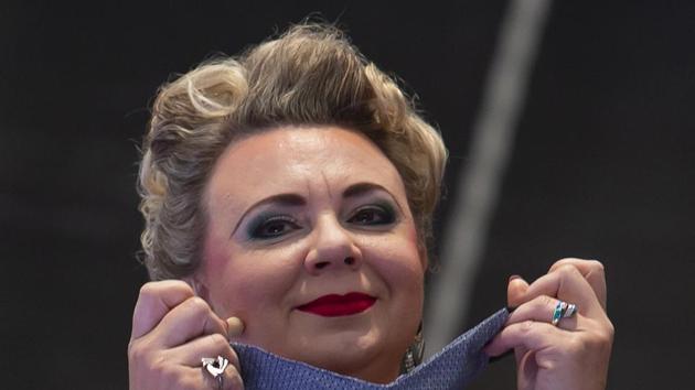 Ukrainian soprano Yulianna Bawarska puts down a face mask during the rehearsal of the Cathedral Steps open air festival (Domstufen-Festspiele) in front of Mariendom (Cathedral of Mary) and St. Severi's Church in Erfurt, Germany, Wednesday, July 8, 2020. (AP) Ukrainian soprano Yulianna Bawarska puts down a face mask during the rehearsal of the Cathedral Steps open air festival (Domstufen-Festspiele) in front of Mariendom (Cathedral of Mary) and St. Severi's Church in Erfurt, Germany, Wednesday, July 8, 2020. (AP)