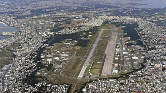 FILE - This Jan. 27, 2018, aerial file photo shows U.S. Marine Air Station Futenma in Ginowan, Okinawa, southern Japan. (AP) FILE - This Jan. 27, 2018, aerial file photo shows U.S. Marine Air Station Futenma in Ginowan, Okinawa, southern Japan. (AP)