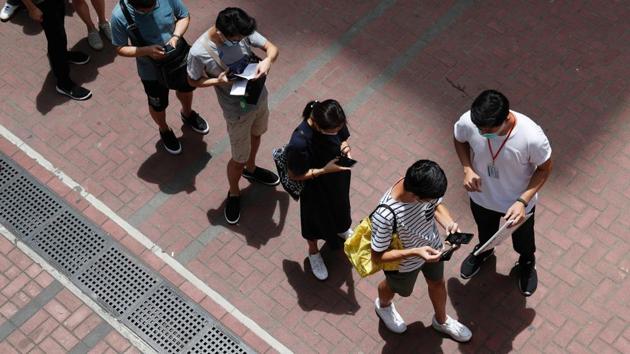 Voters queue up to vote during the primary polls on July 11. Late night on July 10, Hong Kong Police raided the office of Public Opinion Research Institute (PORI), a prominent opinion pollster that was helping the pro democracy camp to conduct the primary, reported AFP. (Tyrone Siu / REUTERS) Voters queue up to vote during the primary polls on July 11. Late night on July 10, Hong Kong Police raided the office of Public Opinion Research Institute (PORI), a prominent opinion pollster that was helping the pro democracy camp to conduct the primary, reported AFP. (Tyrone Siu / REUTERS)